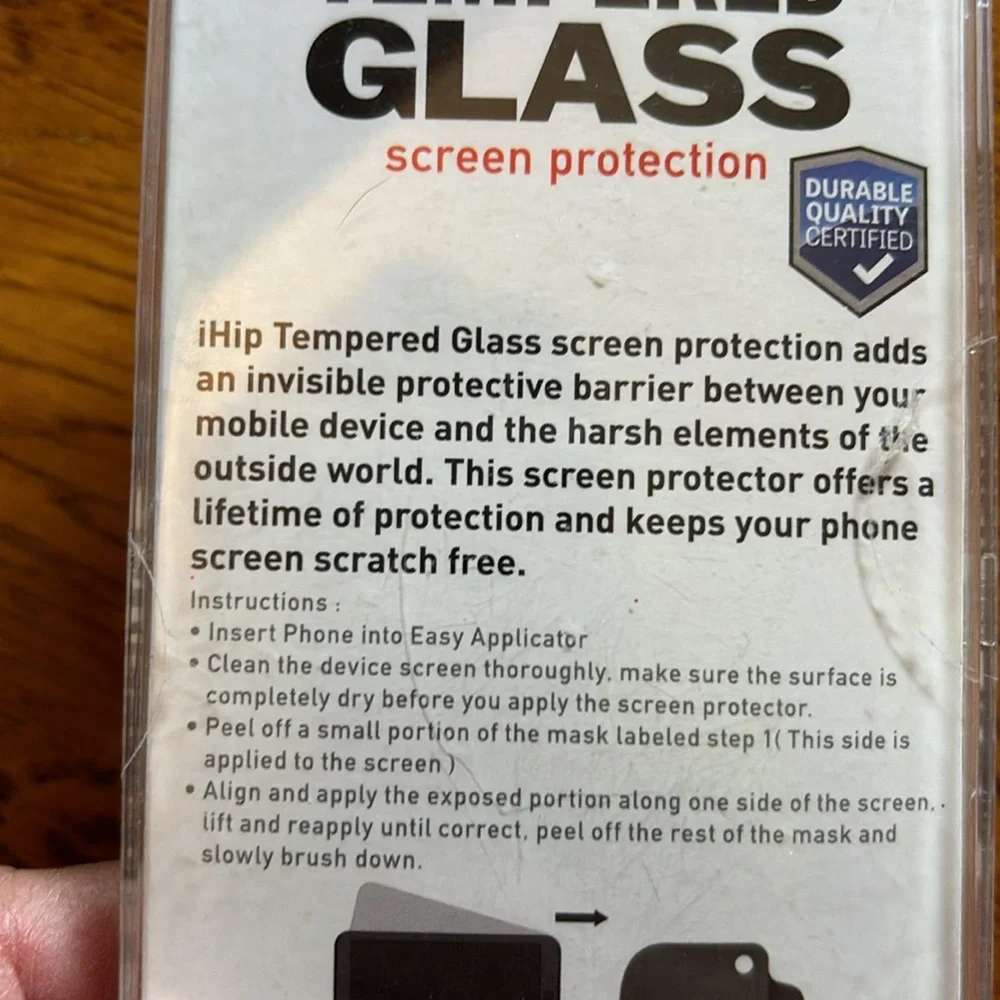 NWT. (New with tape intact). Never opened. Tempered glass iPhone 6/6s
